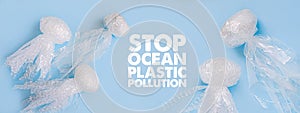 Sea and ocean life from waste. Jellyfishes out of plastic waste on blue background. Pollution of the planet