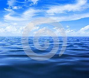 Sea or ocean water with blue sky and clouds