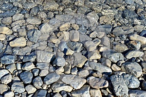 Sea ocean water pebble stones on seashore beach