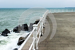 Sea or ocean waves over the white pillars