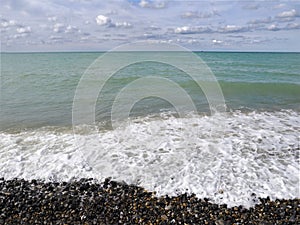 Sea and pebble beach at Treport in France