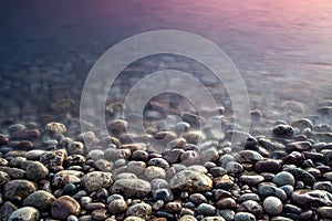 Sea pebble. Nature composition of sunset.