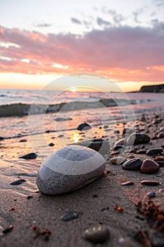 Sea pebble nature composition on sunset