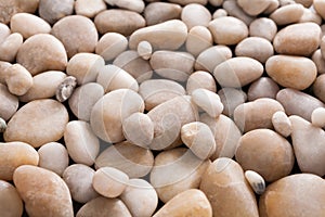 Sea pebbles background, natural seashore stones