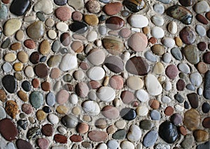 Sea pebbles in the sand.