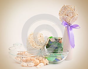 Sea pebbles and shells in glass containers