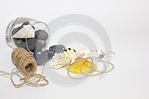 Sea pebbles and shells scattered from the glass. Twine for packing. Summer memories.