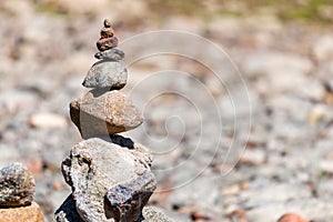 Sea pebbles or stones tower on a beach