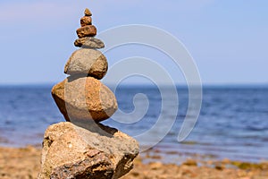 Sea pebbles or stones tower on a beach