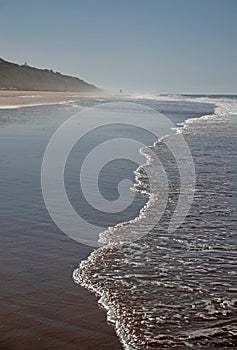 Sea at Playa de Rompeculos beach in Mazagon, Spain photo