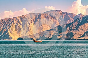 Sea, pleasure boats, rocky shores in the fjords of the Gulf of Oman