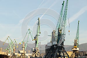 Sea port, crane in dock, logistics and delivery, dry-cargo ship