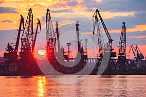 Sea port and industrial cranes, Varna, Bulgaria.Sunset over the Varna lake