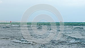 The sea rages in the background Windsurfer
