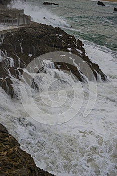 Sea raging wild waves in the sea of the city of Santander, Spain