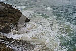 Sea raging wild waves in the sea of the city of Santander, Spain