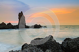 Sea rock on the seacoast natural sunset