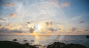 Sea and rock stones on the beach with sand in sunset.,nature sea scene and landscape photography, Sunset at peaceful Rock Beach