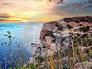 Sea and rock at the sunset. Beauty of nature concept background. Arnarstapi sea cliffs. Seascape with rocky beach, turquoise water