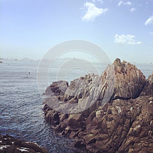 Sea rocks beach blue sky