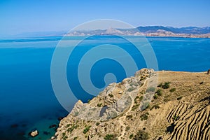 Sea and rocks landscape at Cape Meganom, the east coast of the peninsula of Crimea. Colorful background. Travelling concept.