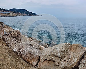 Sea and rocks, photo as a background , in finale ligure, genova, italy