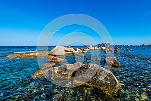 Sea Rocks and Tower in Nora near Pula, Sardegna photo