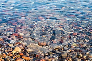 Sea rocks under the water. Texture sea pebbles. Natural stone background