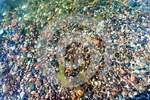 Sea rocks under the water. Texture sea pebbles. Natural stone background