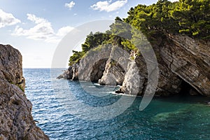 Sea and rocky clifs in town Petrovac, Montenegro