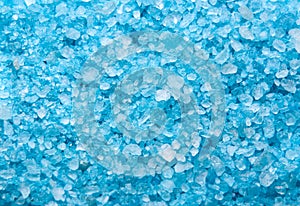 Sea salt background or texture in blue color. Little minerals