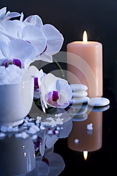 Sea salt with candle and orchid