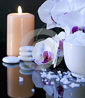 Sea salt with candle and orchid