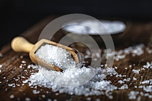 Sea salt on a dark wooden background