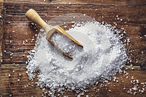 Sea salt on a dark wooden background