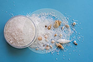 Sea salt for exfoliation on blue background