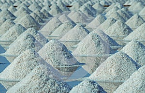 Sea salt farm in Thailand. Organic sea salt. Evaporation and crystallization of sea water. Raw material of salt industrial. photo