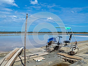 Sea salt fields local farm industry on a beautiful blue sky in Thailand