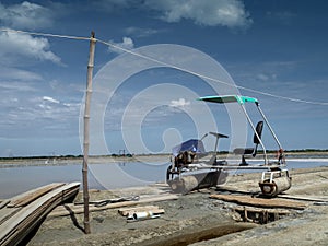 Sea salt fields local farm industry on a beautiful blue sky in Thailand