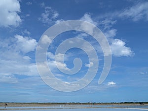 Sea salt fields local farm industry on a beautiful blue sky in Thailand