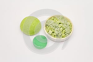 Sea salt, green tea soap and sponge isolated on white background