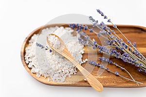 Sea salt heap, lavender and spoon on wooden tray