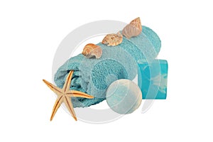 sea salt Spa soap, folded blue towel and star isolated on white background