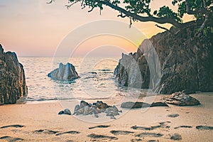 Sea, sand and rock at the sunset. Nature composition.