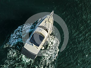 Sea service team in fast speed motor boat top overhead view