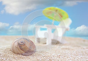 Sea Shell and Beach Chair on beach, Shallow DOF, Focus on Shell