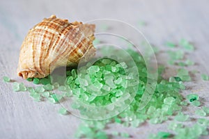 Sea shell and sprinkled bath salt