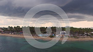 Sea shore in cloudy weather above