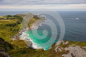 Sea shore landscape, view from the hill to lagoon with turquoise water and sea, Vagsoy island, Norway