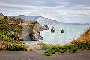 sea shore rocks and mount Taranaki, New Zealand